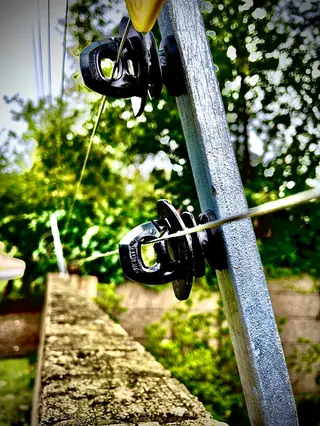 Close-up of electric fence insulators on a post