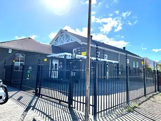 Palisade fencing and gate at a commercial building