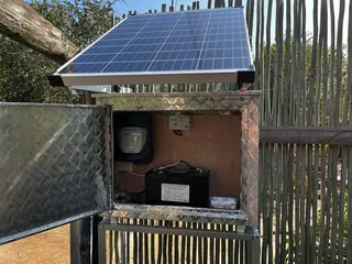 Solar panel and battery enclosure for an electric fence