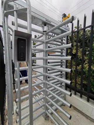 Full-height turnstile with access control reader