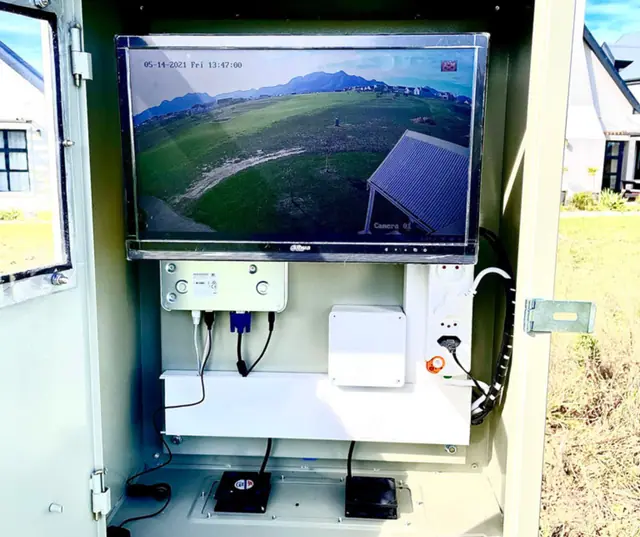 Outdoor enclosure housing a CCTV monitor and recorder